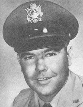 A black and white headshot of Pete Ray with his pilot hat on.